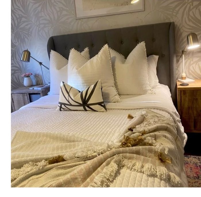 Bedroom made up with fresh linens after a cleaning